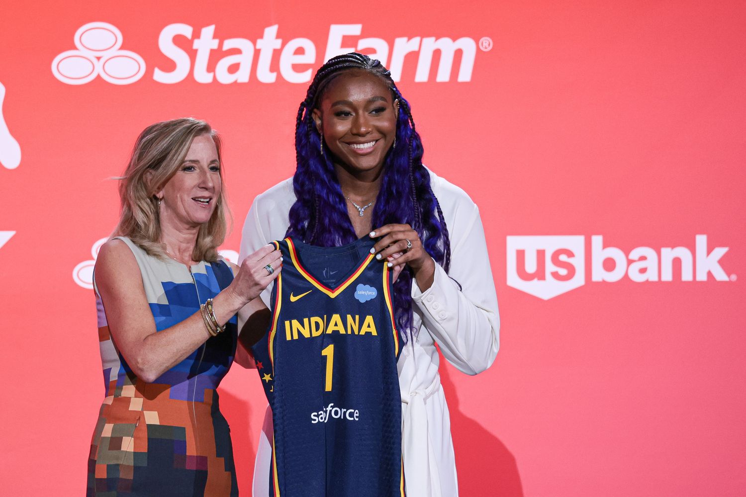WNBA Commissioner Cathy Engelbert and Aliyah Boston pose for a photo.